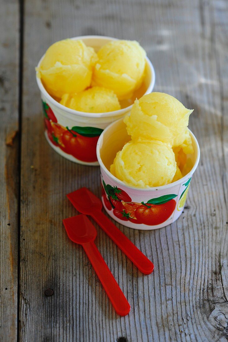 Mandarin sorbet in ice cream tubs