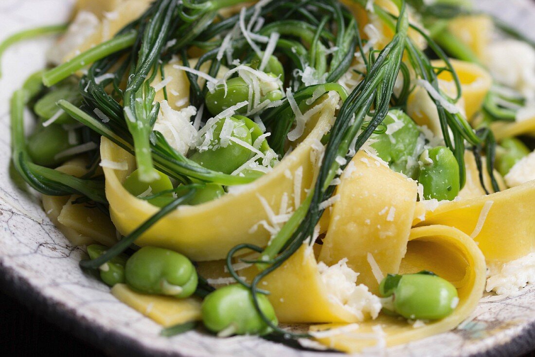 Tagliatelle with buck's horn plantain, broad beans and grated Parmesan cheese