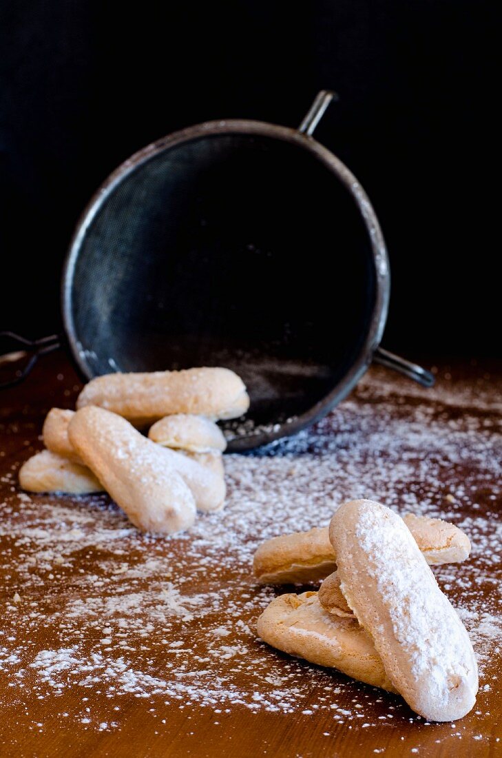 Homemade sponge fingers with icing sugar