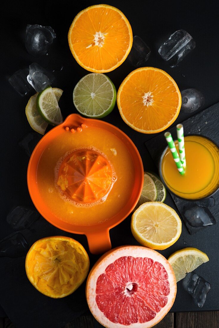 Freshly pressed orange juice and halved citrus fruit