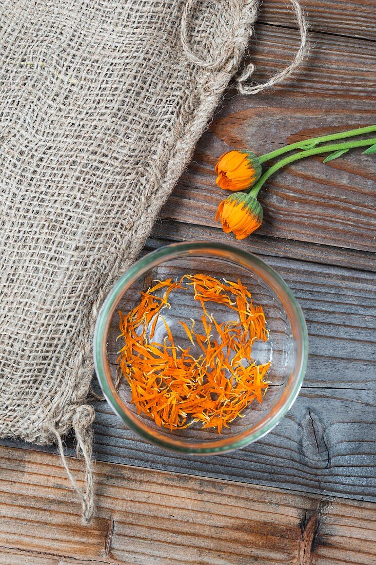 Marigold petals in a glass bowl (seen from above)