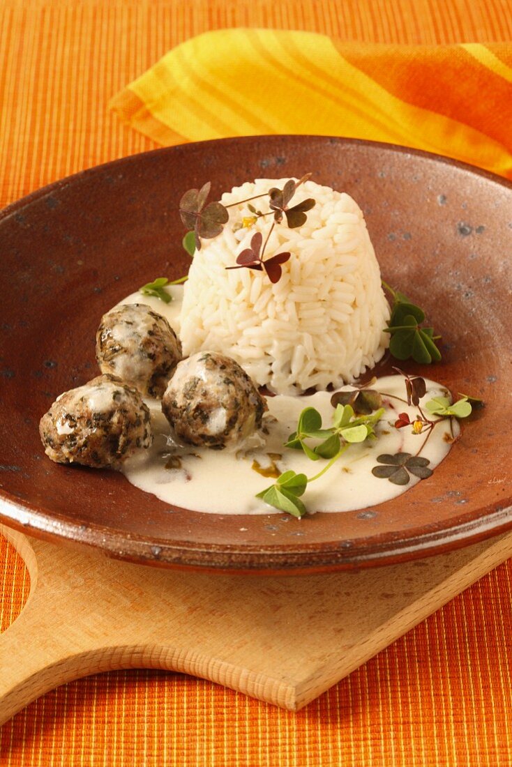 Herb meatballs with rice and a creamy sauce