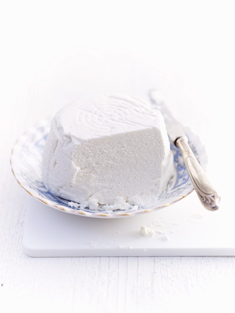 Ricotta on a plate, sliced