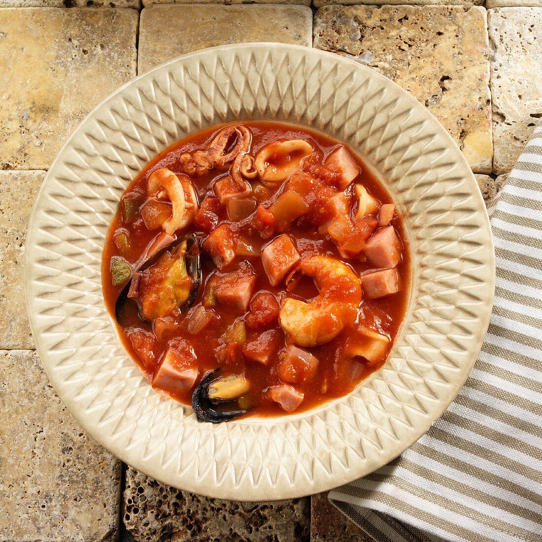 Catalan seafood stew with serrano ham (Spain)