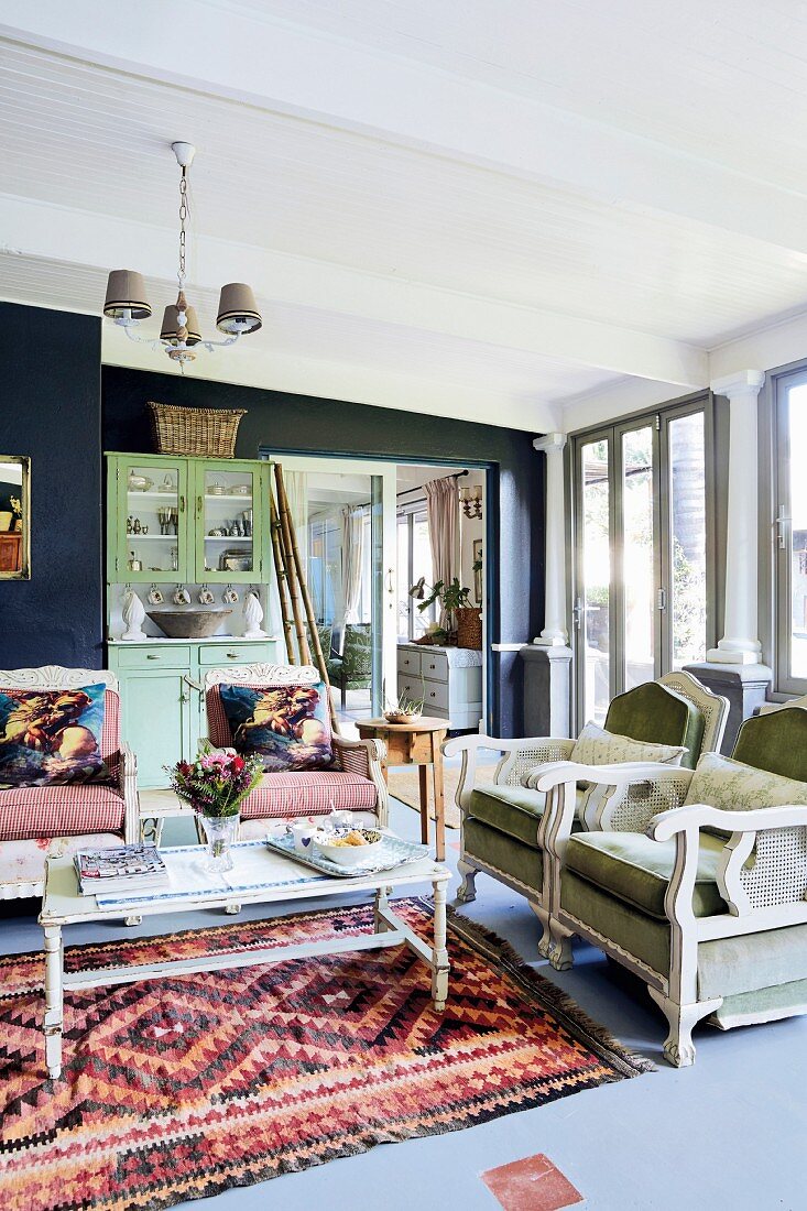 Vintage seating and coffee table on rug in living room