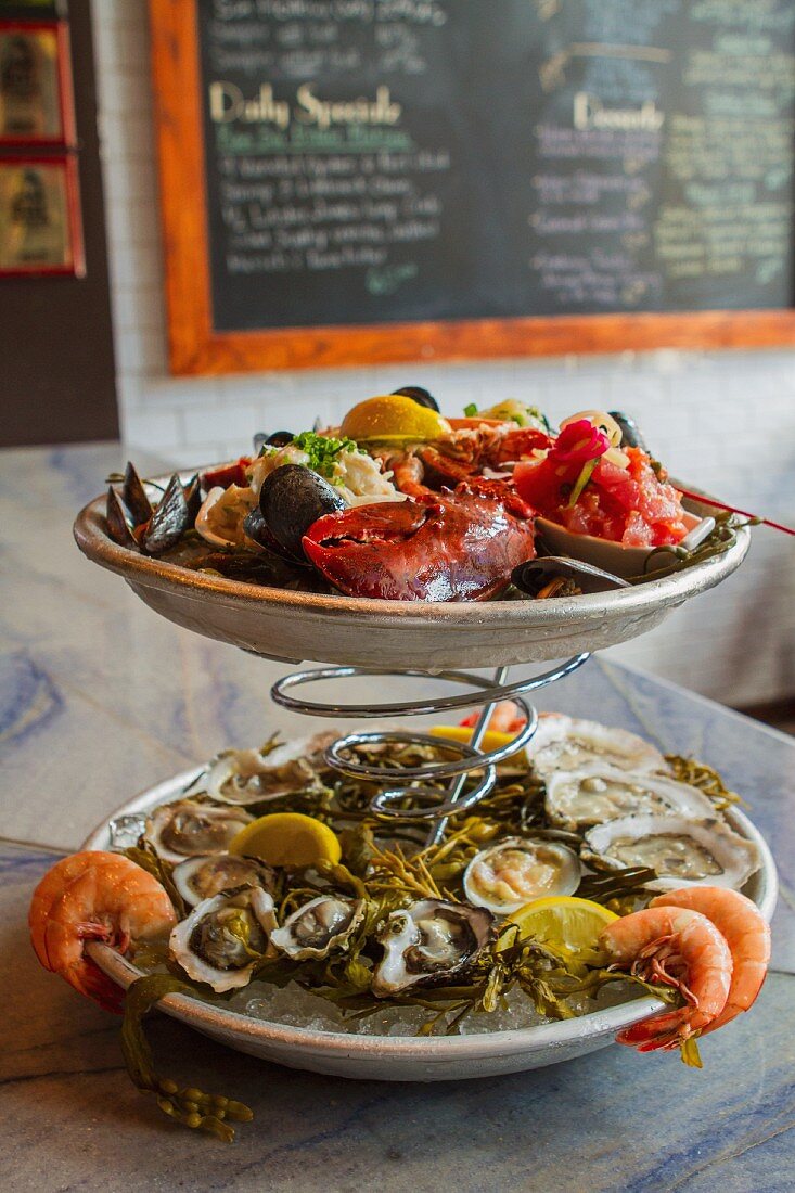 A seafood platter featuring lobster, oysters and shrimps in a restaurant