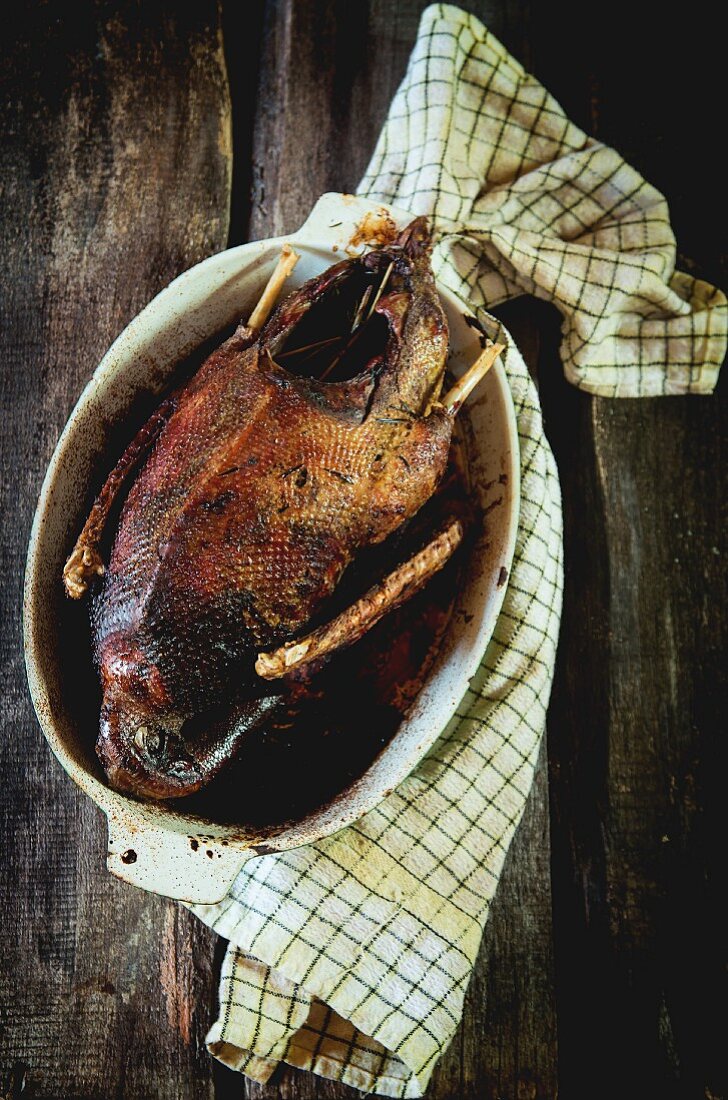 Grilled goose in a roasting dish