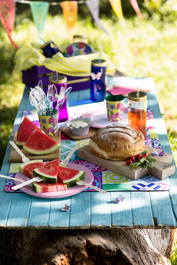 Picnic with watermelon and caprese bread