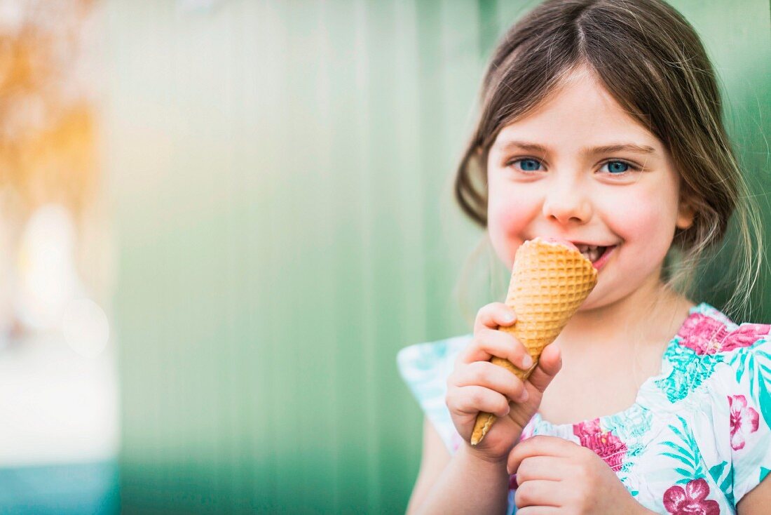 A little girl eating ice cream