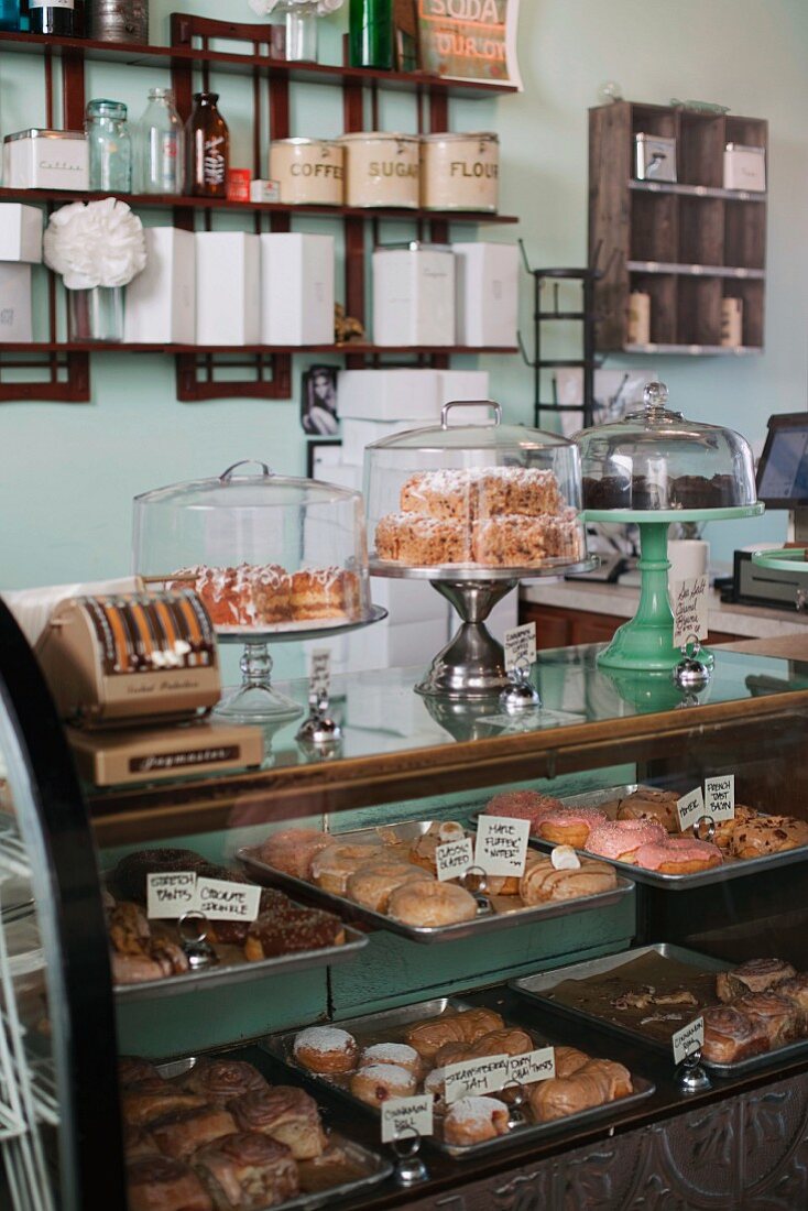 Cakes and pastries in a display cabinet in a vegan bakery