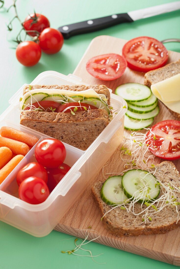 A cheese, cucumber, tomato and bean sprout sandwich for lunch box