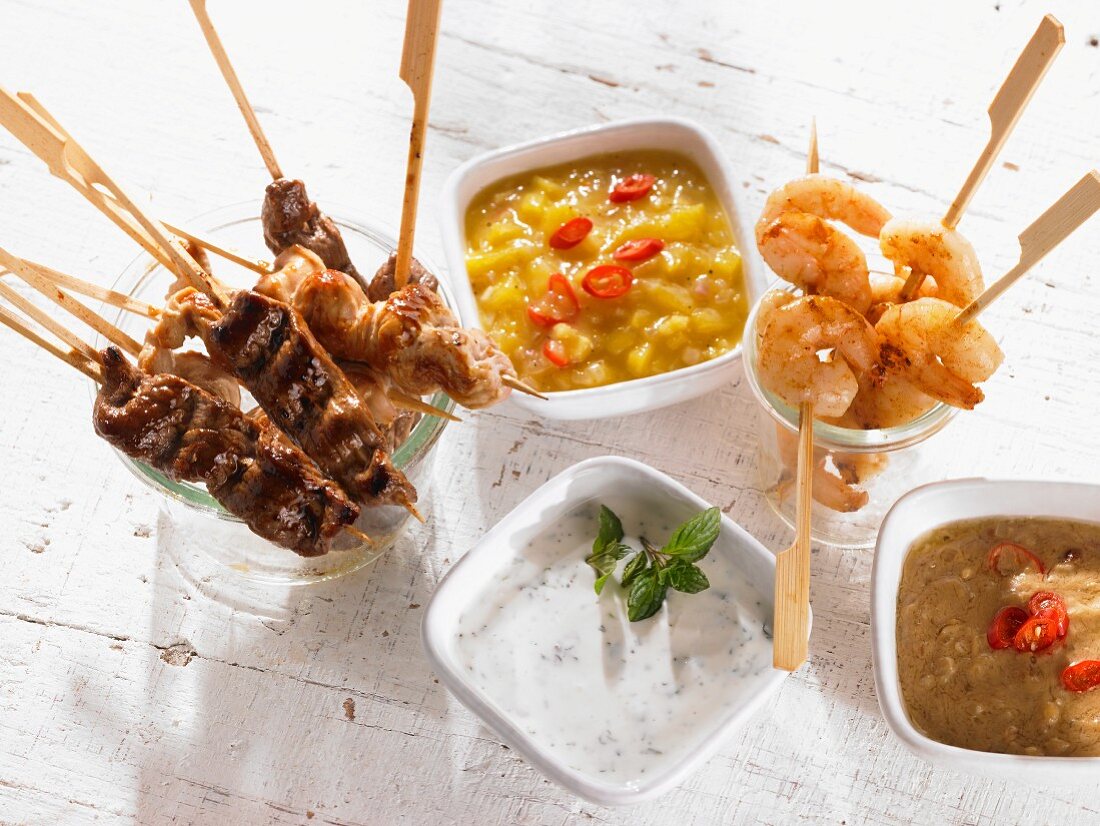 Meat, poultry and prawn skewers with dips