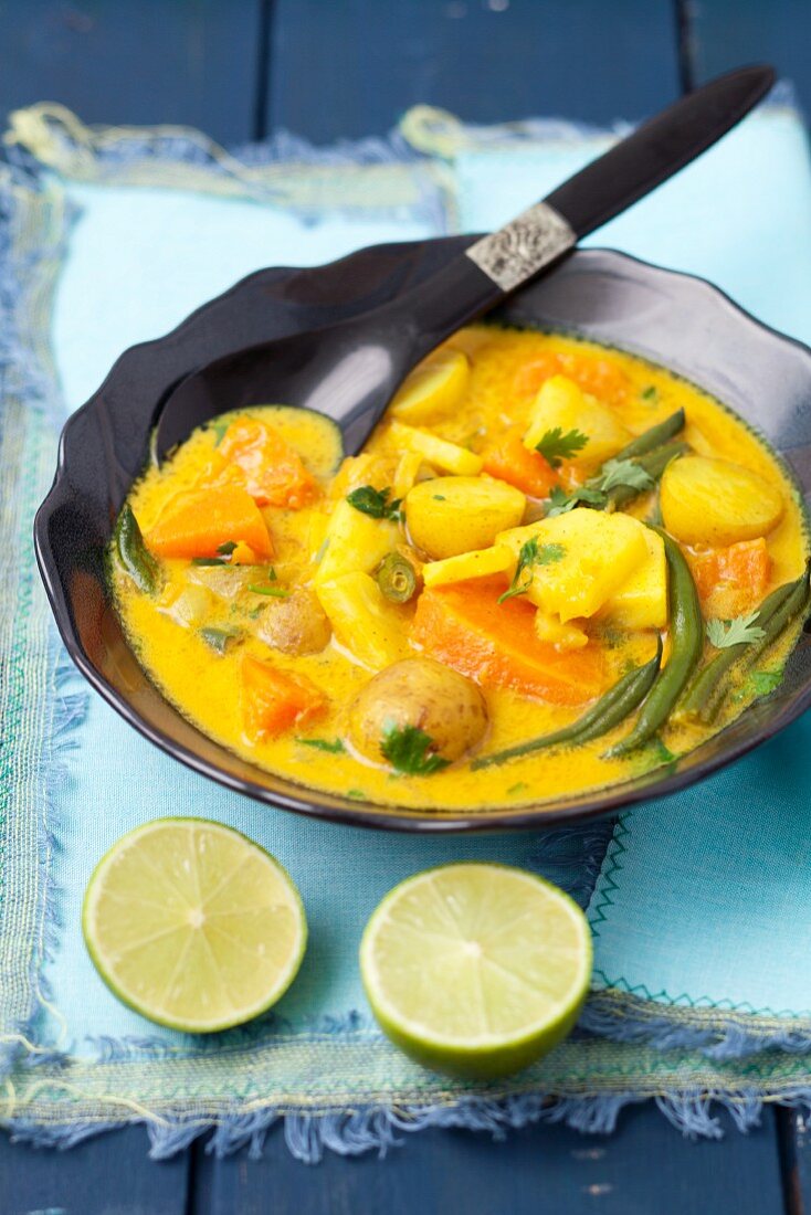 Indian vegetarian curry with pumpkin, pineapple, beans and potatoes