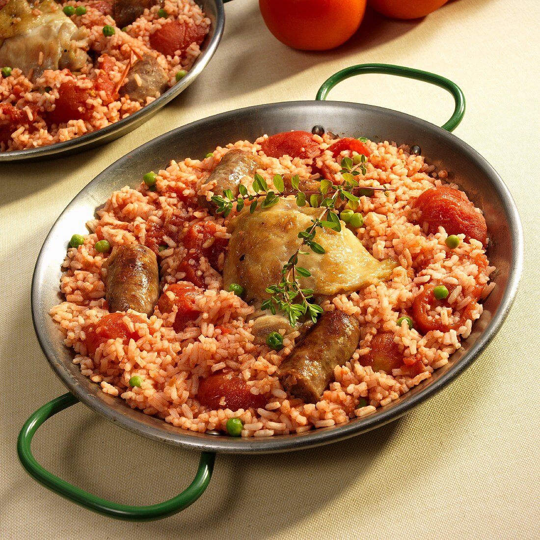 Paella with chicken, sausage and tomatoes
