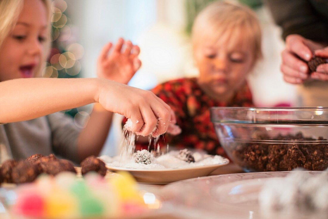 A mother and daughter baking for Christmas