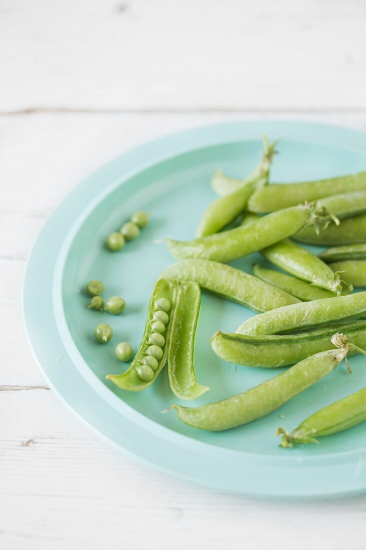 Fresh pea pods on a plate