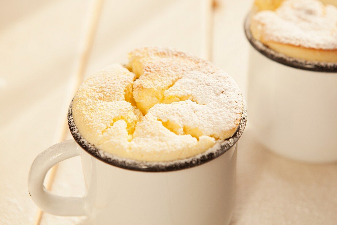 Lemon soufflés in enamel mugs