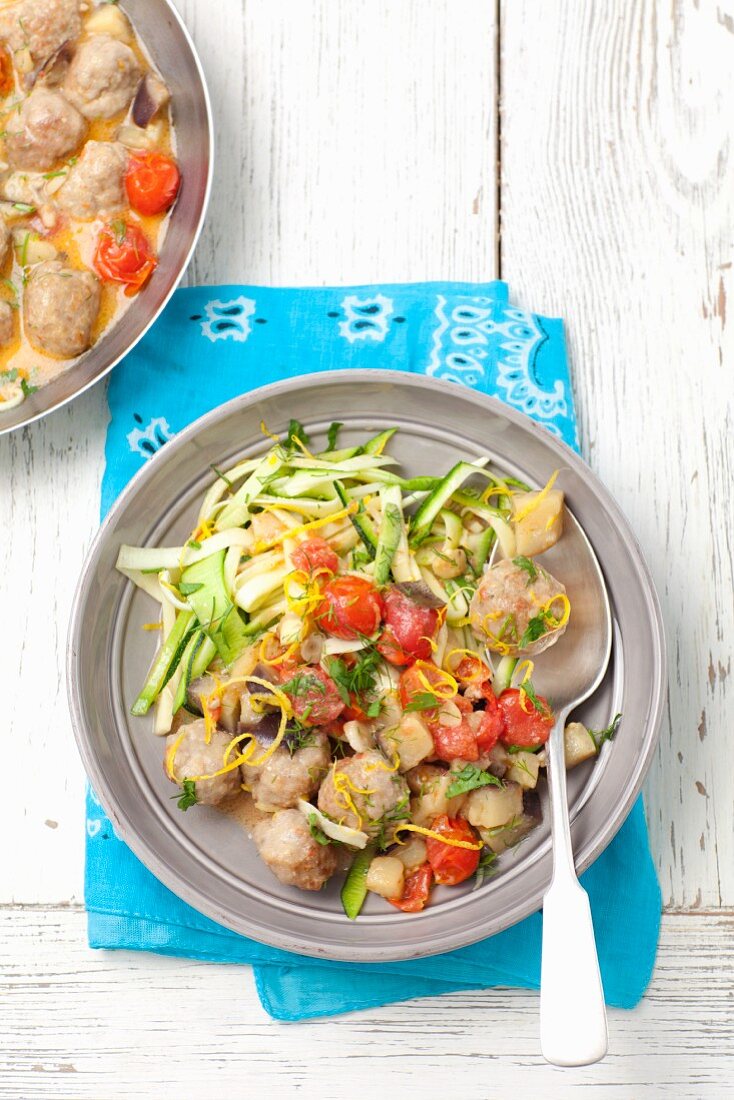 Meatballs with aubergine, tomatoes and courgette strips