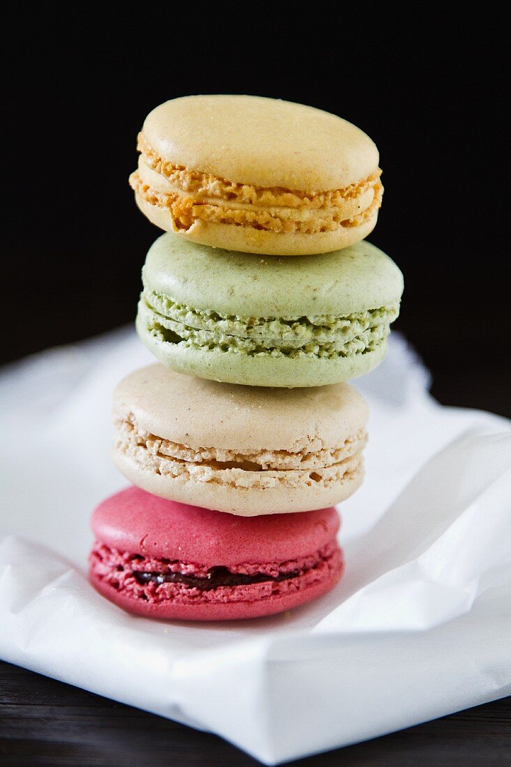 A stack of four different coloured macaroons