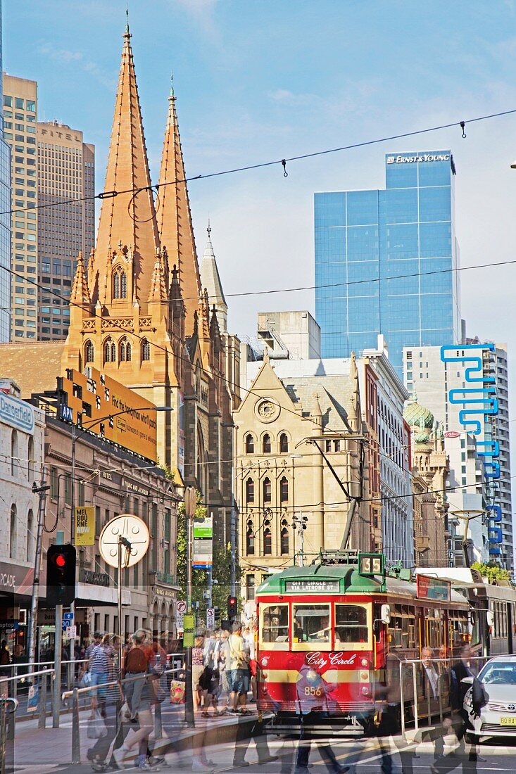 A tram and St Paul's Cathedral on Flinders Street, Melbourne, Australia