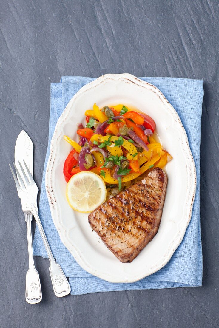 Tuna steak with roasted peppers and capers