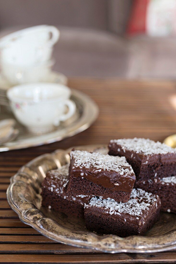 Swedish chocolate and coconut brownies on silver plate