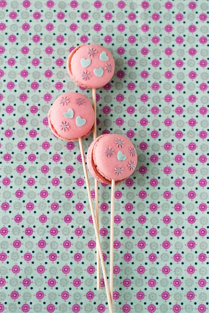 Macaroon lollies decorated with edible paper