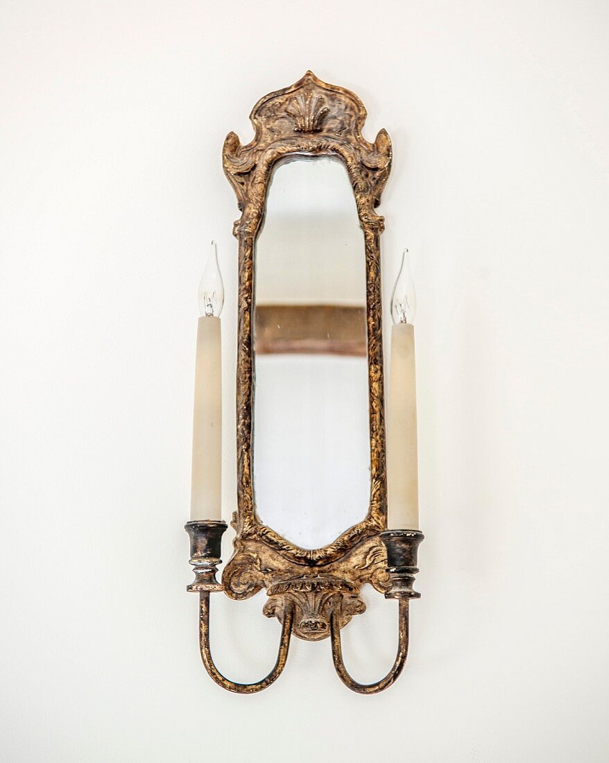 Antique candle sconce with integrated mirror