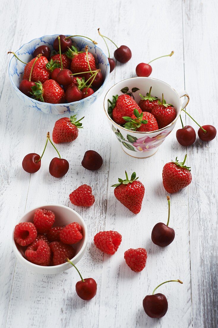 Summer fruits on a white wooden table