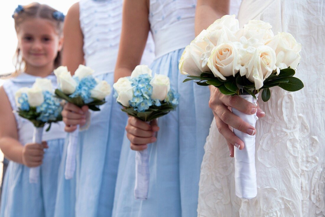 A bride and bridesmaids with bouquets (detail)