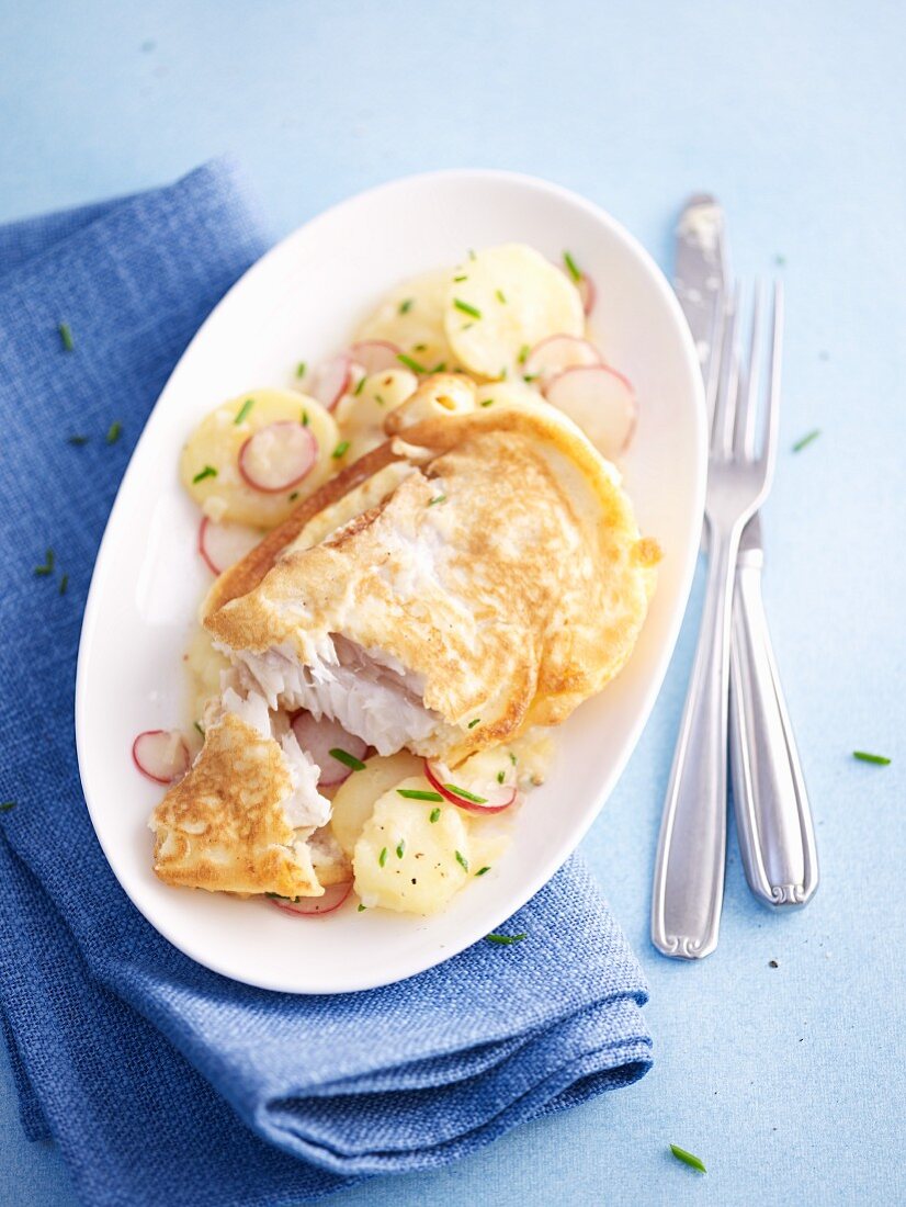 Cod with a potato coating with a potato radish salad