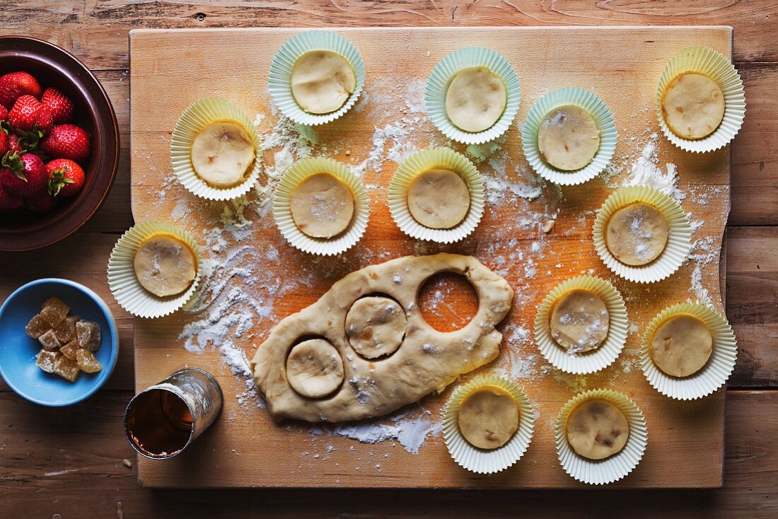 Pastry being cut out to make ginger and strawberry biscuits