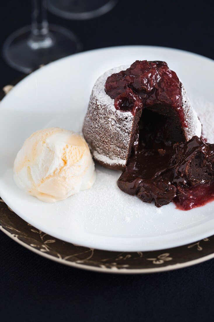 Chocolate fondant cake with raspberry sauce and vanilla ice cream