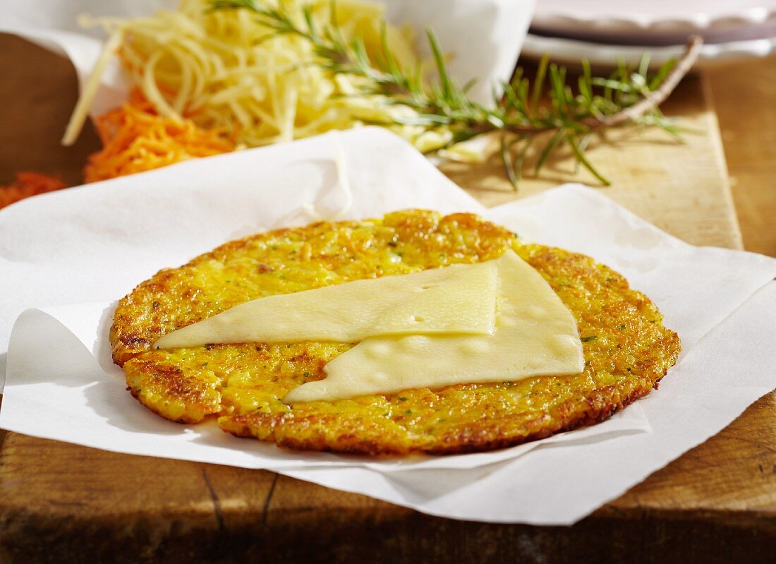 A potato fritter topped with Appenzeller cheese