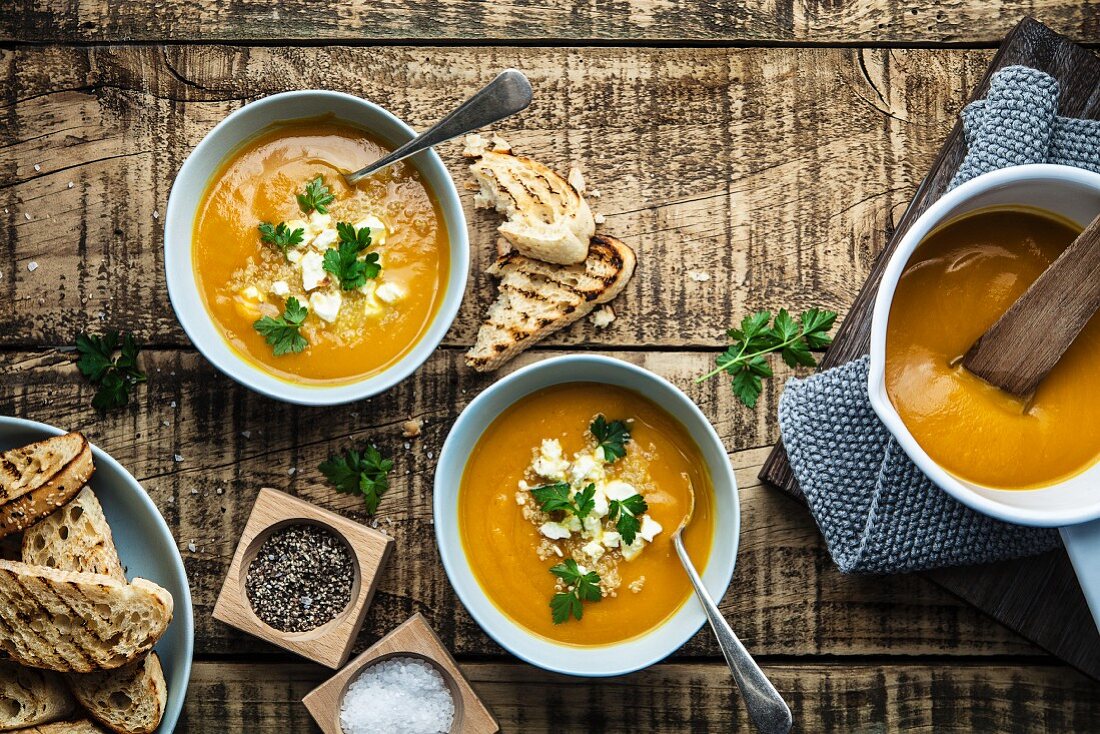 Rustic pumpkin soup with quinoa and feta