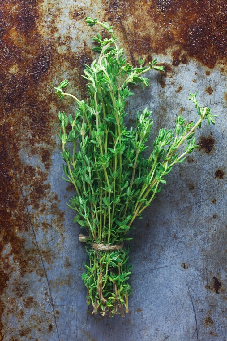 A bunch of thyme on a metal surface