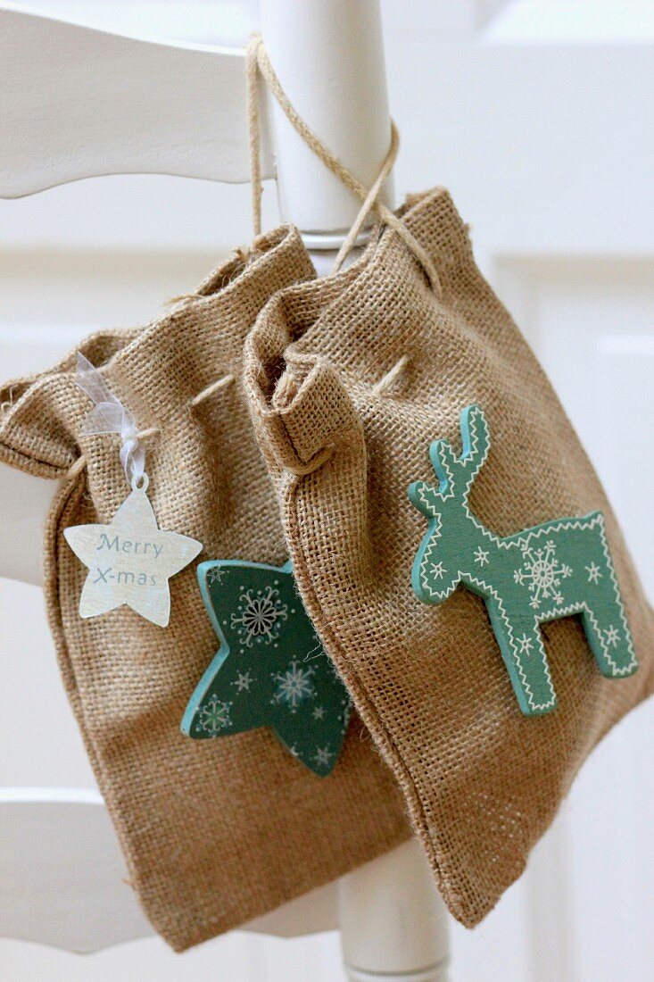 Hand-sewn hessian bags decorated with star and moose motifs
