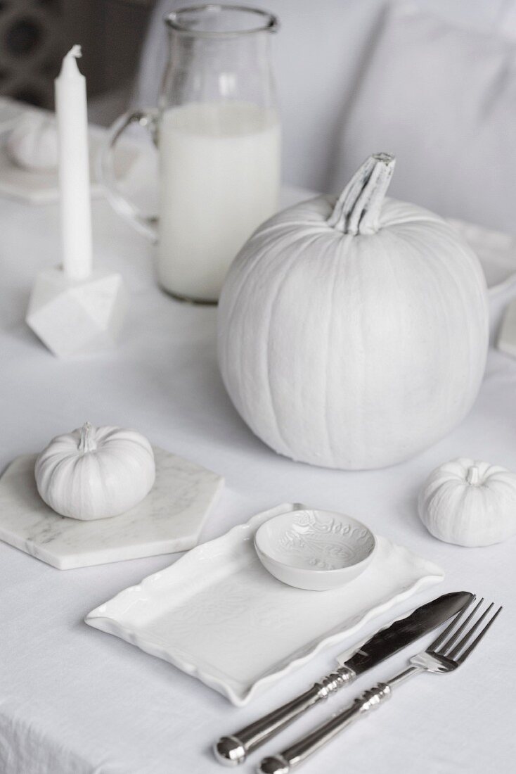 Set table with white Halloween decorations