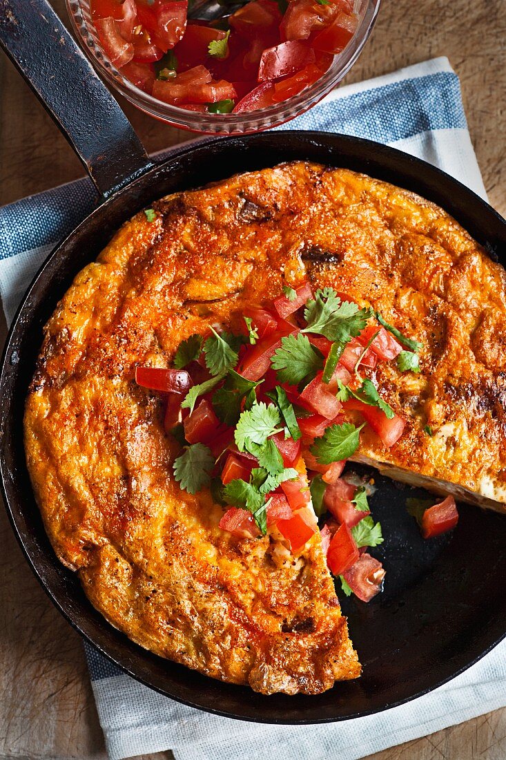Chorizo and tomato frittata in a pan (Spain)