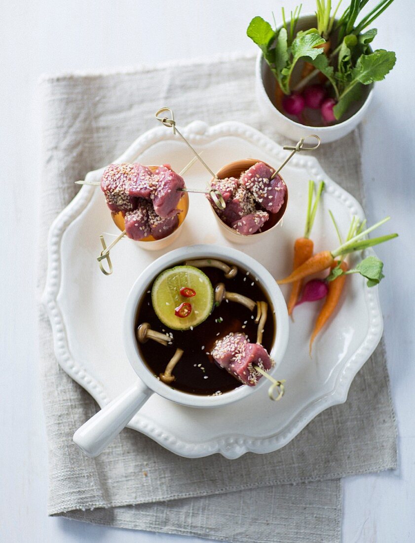 Beef fondue with carrots, radishes and mushrooms (Asia)