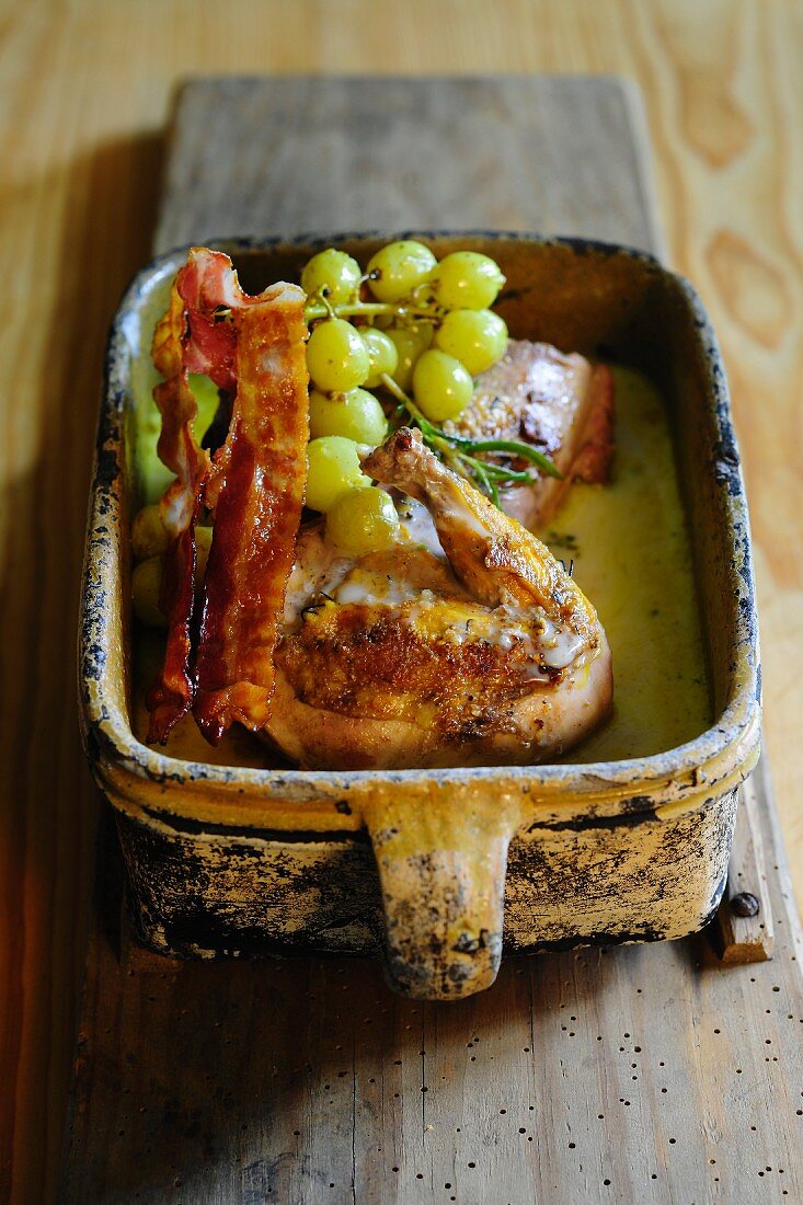 Roasted pheasant with bacon and grapes