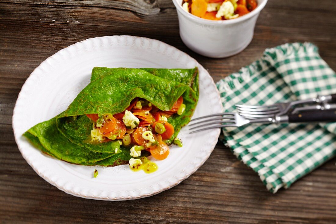 Spinach pancakes with a feta and carrot medley