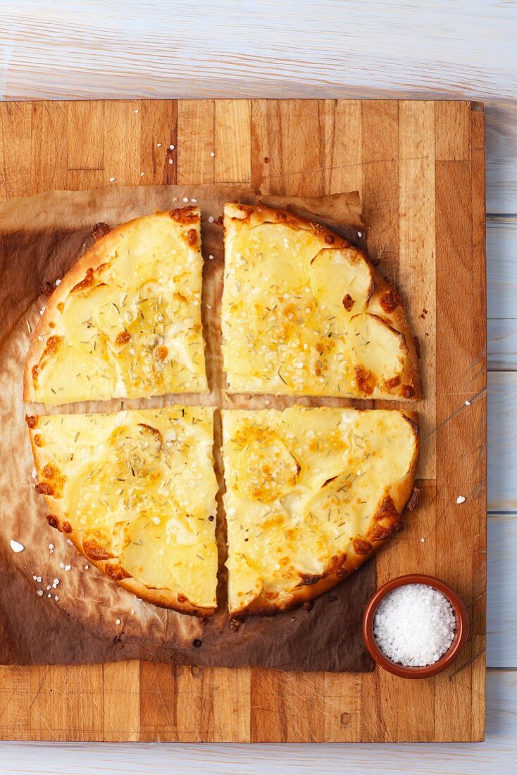 Pizza bianca with potatoes, quartered