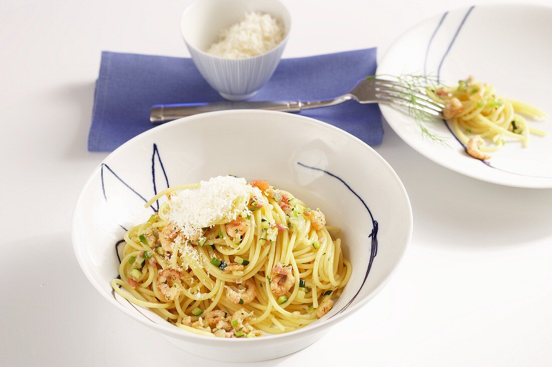 Spaghetti with shrimp ragout and Parmesan cheese