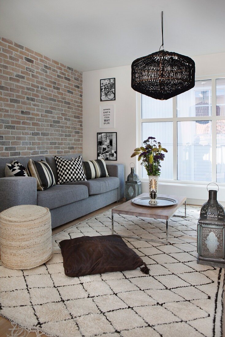 Brick wall and Oriental accessories in Scandinavian living room