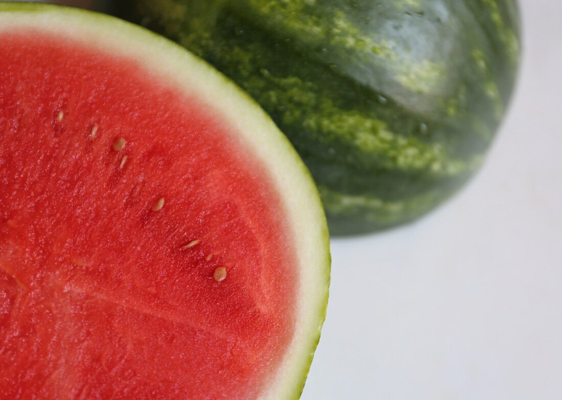 A watermelon on a marble surface