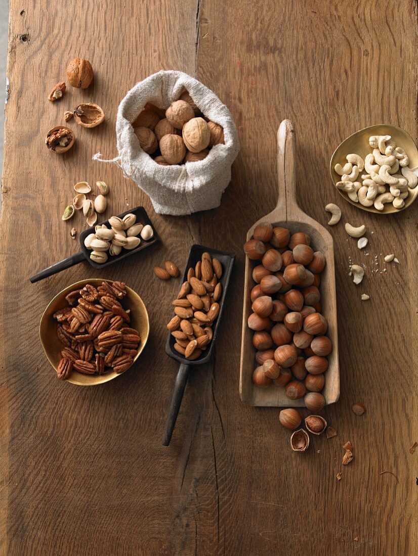 Various nuts on a rustic wooden table