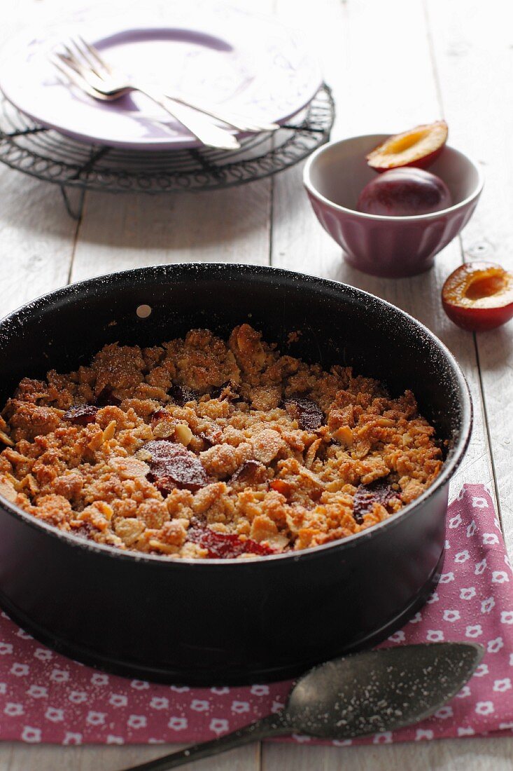 Plum crumble in baking dish