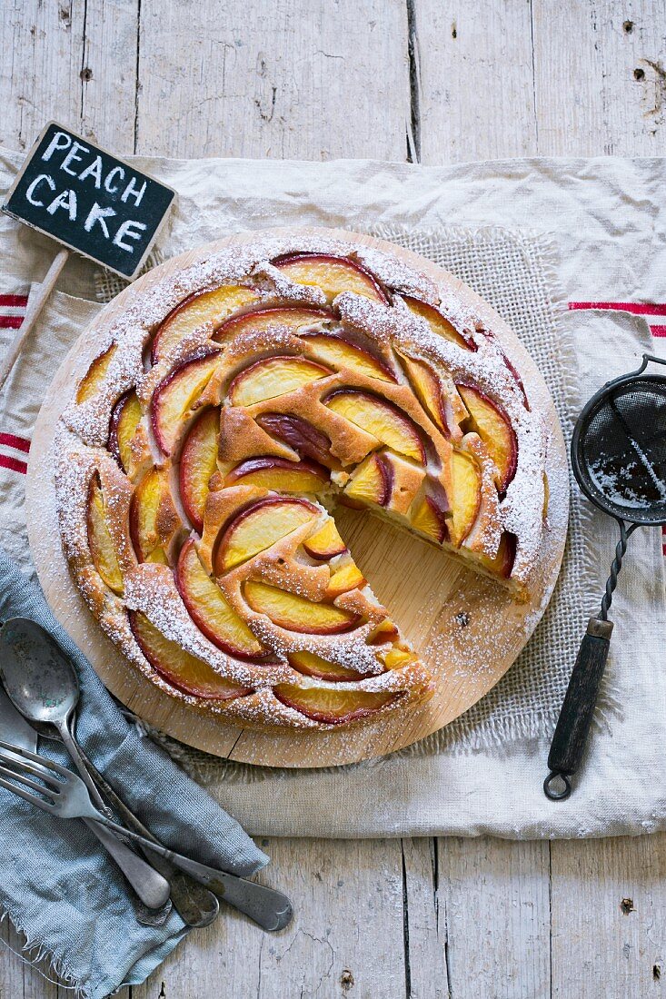 Peach cake with icing sugar