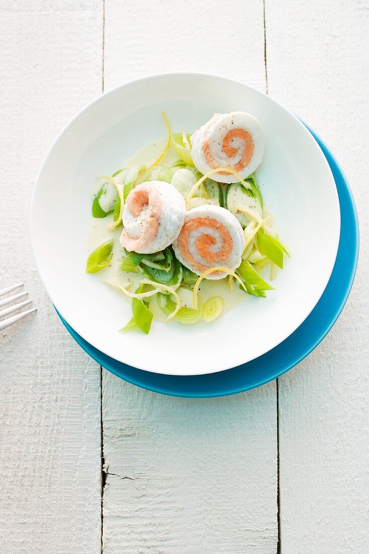 Salmon and plaice rolls on a leak medley